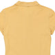 Vintage yellow Lacoste Polo Shirt - womens large